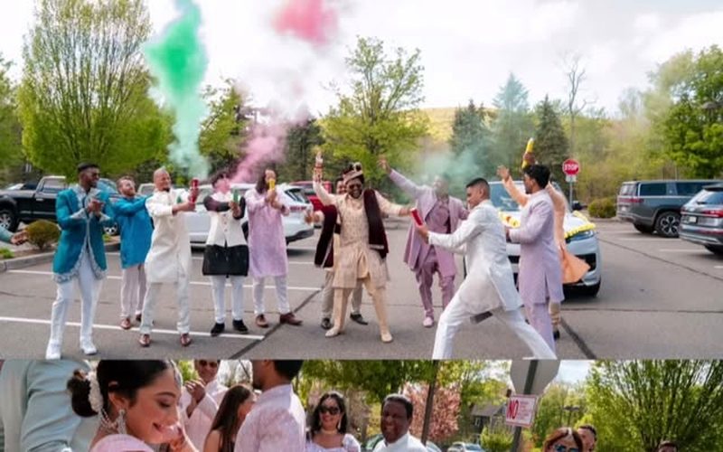 Baraat procession with color smoke at a desi wedding celebration