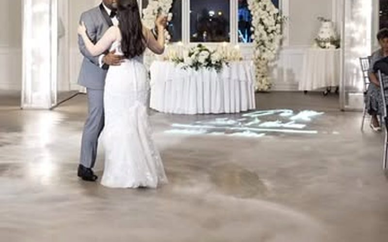 First dance with a custom monogram projected on the floor and cloud effect