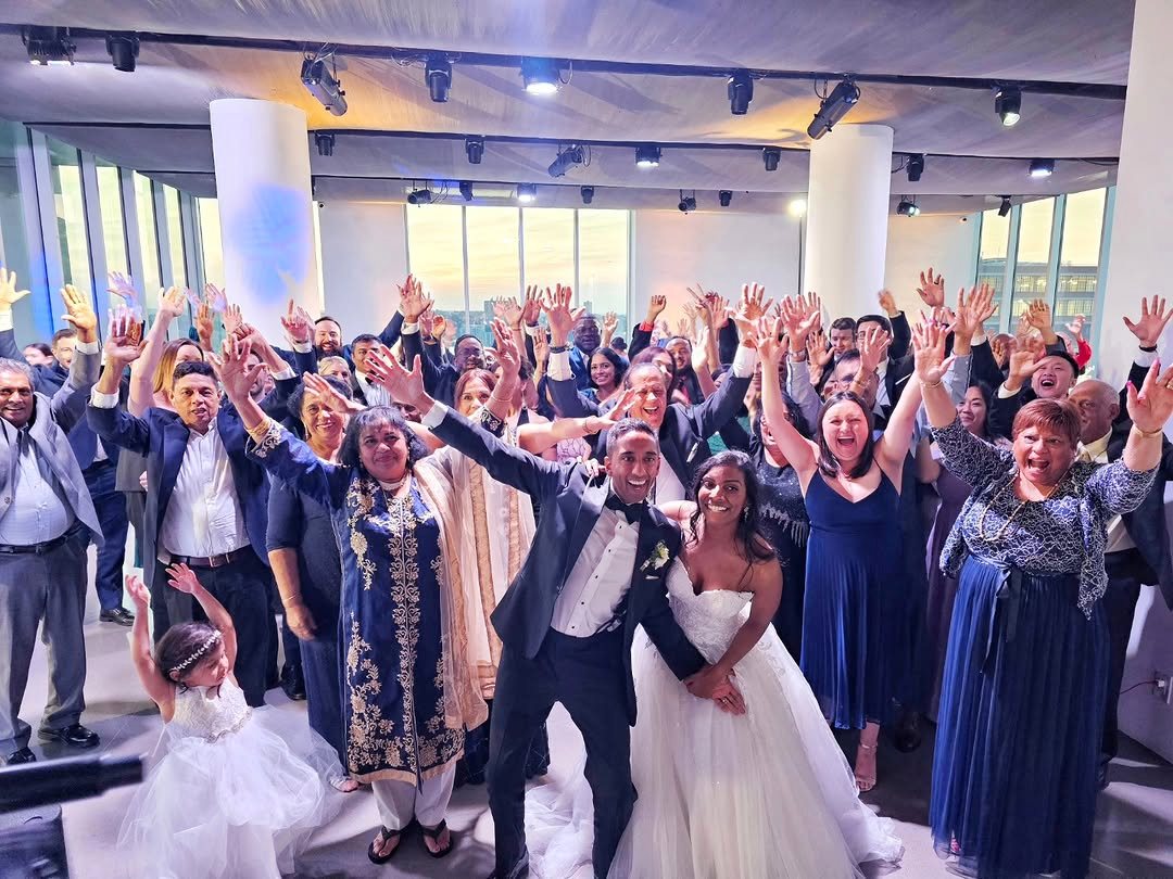 Packed dancefloor with hands in the air