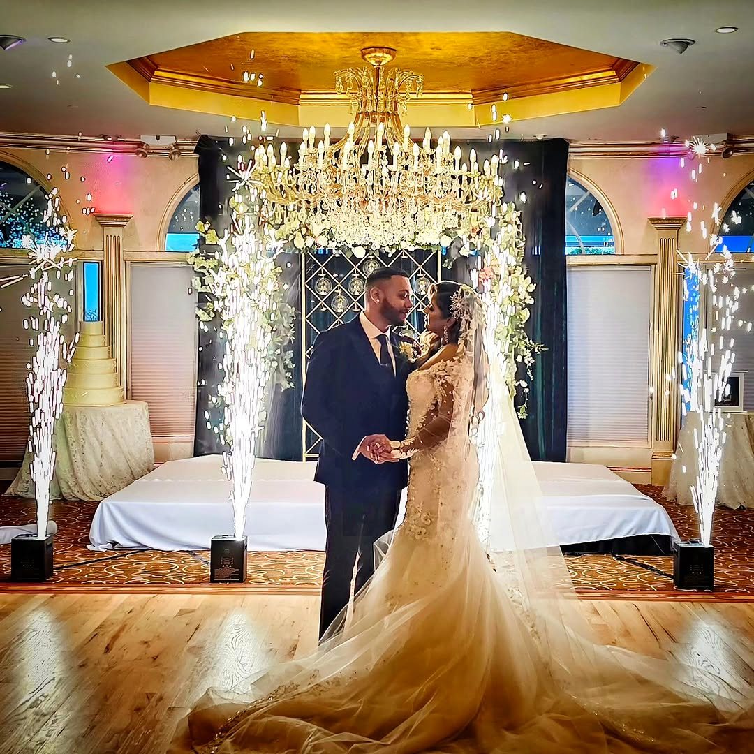Bride and groom's first dance with cold spark fountains