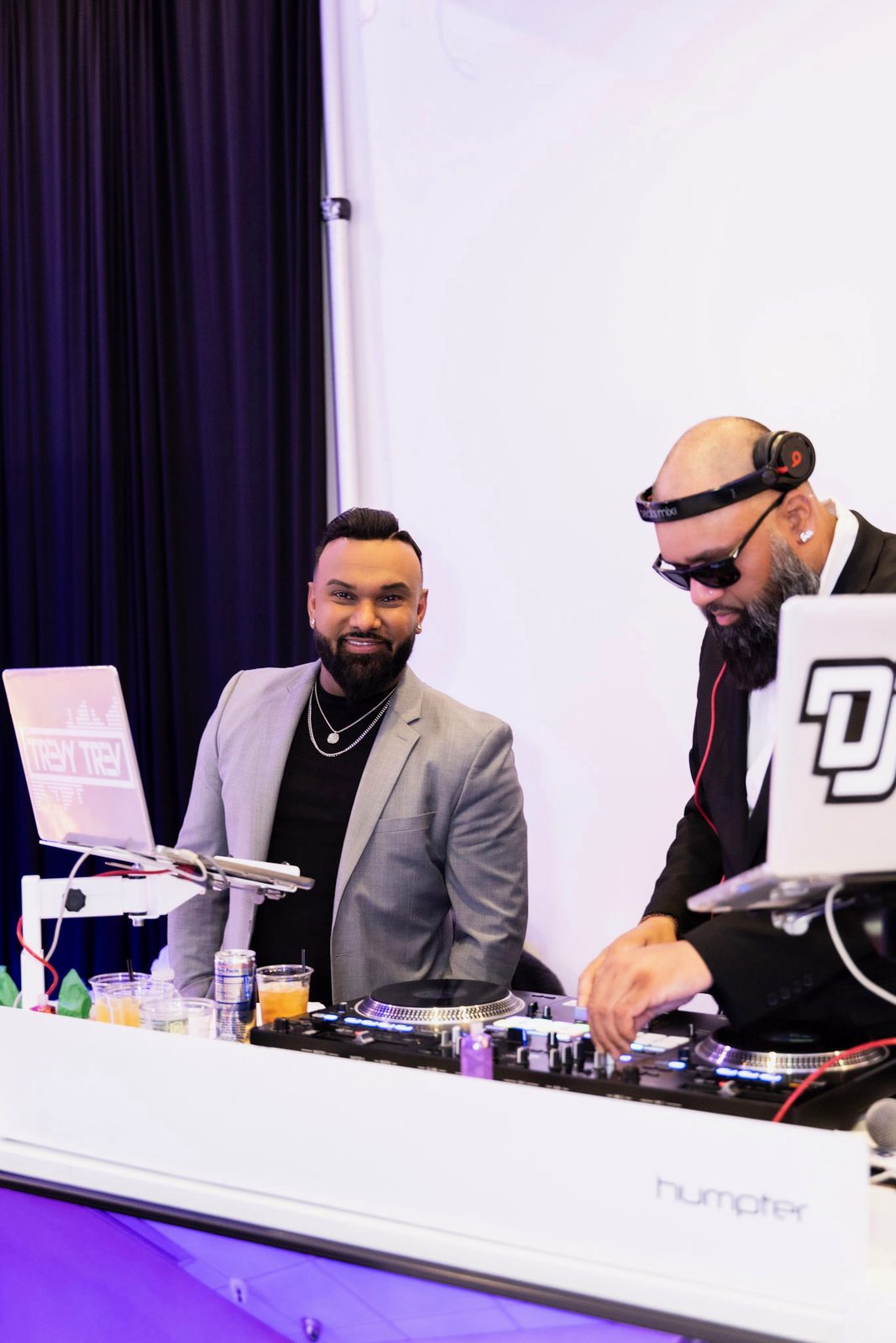 Two of the crew mid-set at the booth