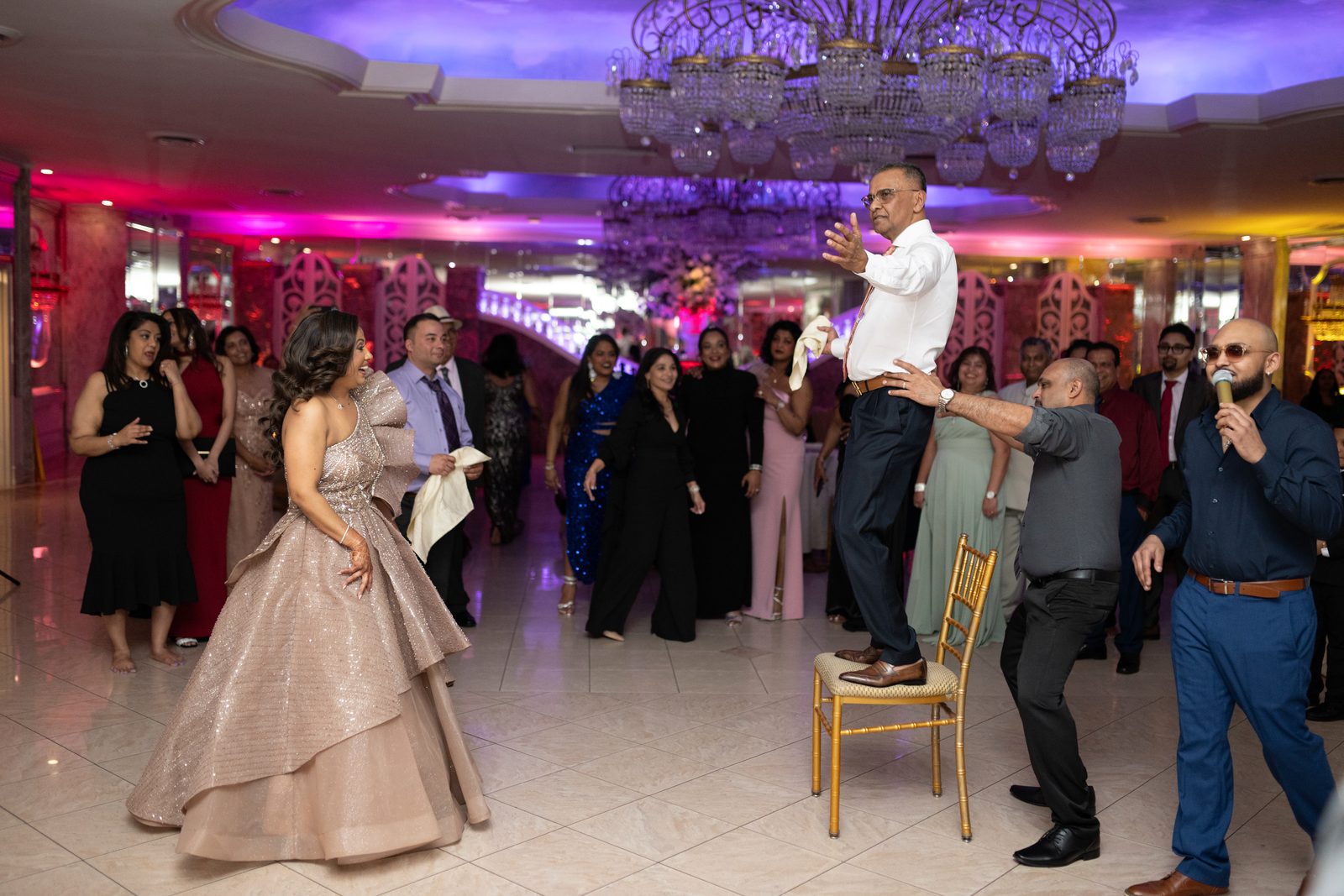 Guest lifted on shoulders over the dancefloor
