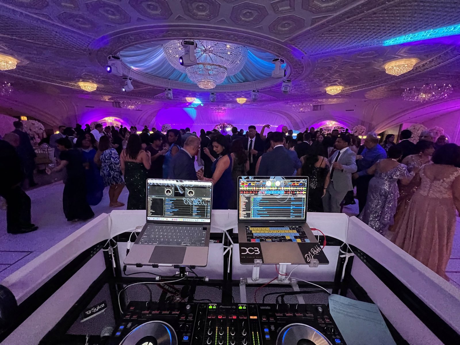 View from the booth over a pink-lit ballroom