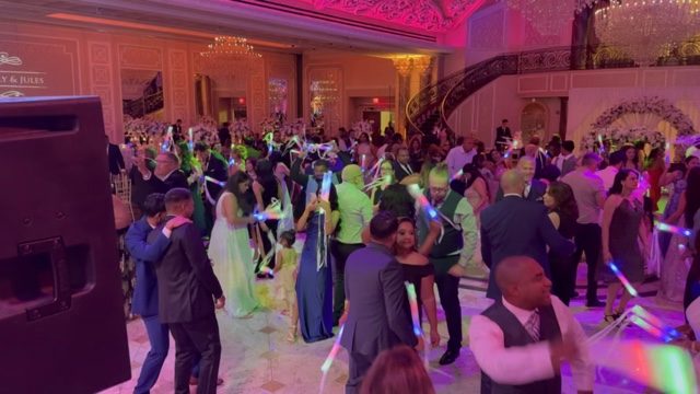 Green-lit party moment on the dancefloor