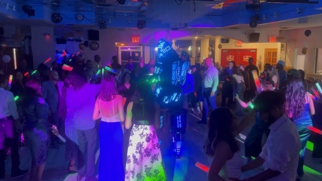 LED robot performer surprising the crowd